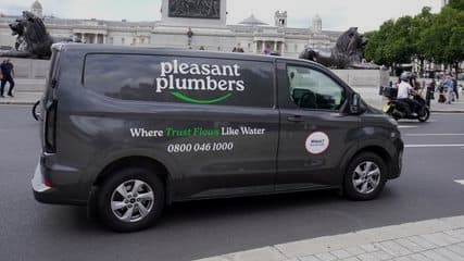 Pleasant Plumbers van in Trafalgar Square, central London
