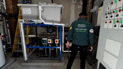 Engineer working on a cold water booster set